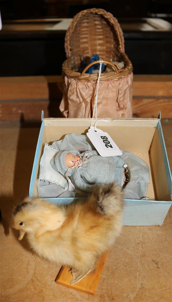 Miniature doll and dolls pram, another doll & a chick